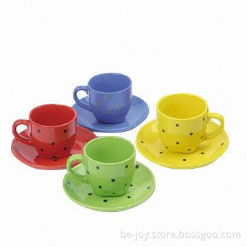 Stoneware cup and saucer with hand printing